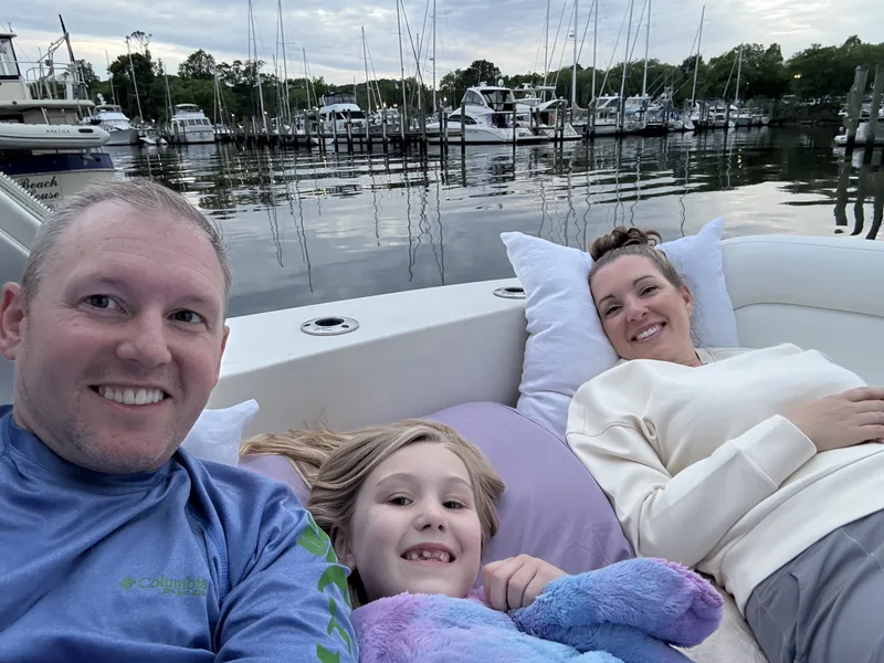 Donny Morrell and his family relaxing on their boat at a marina